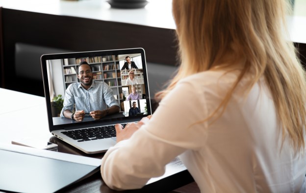 woman participating in an online meeting with colleagues