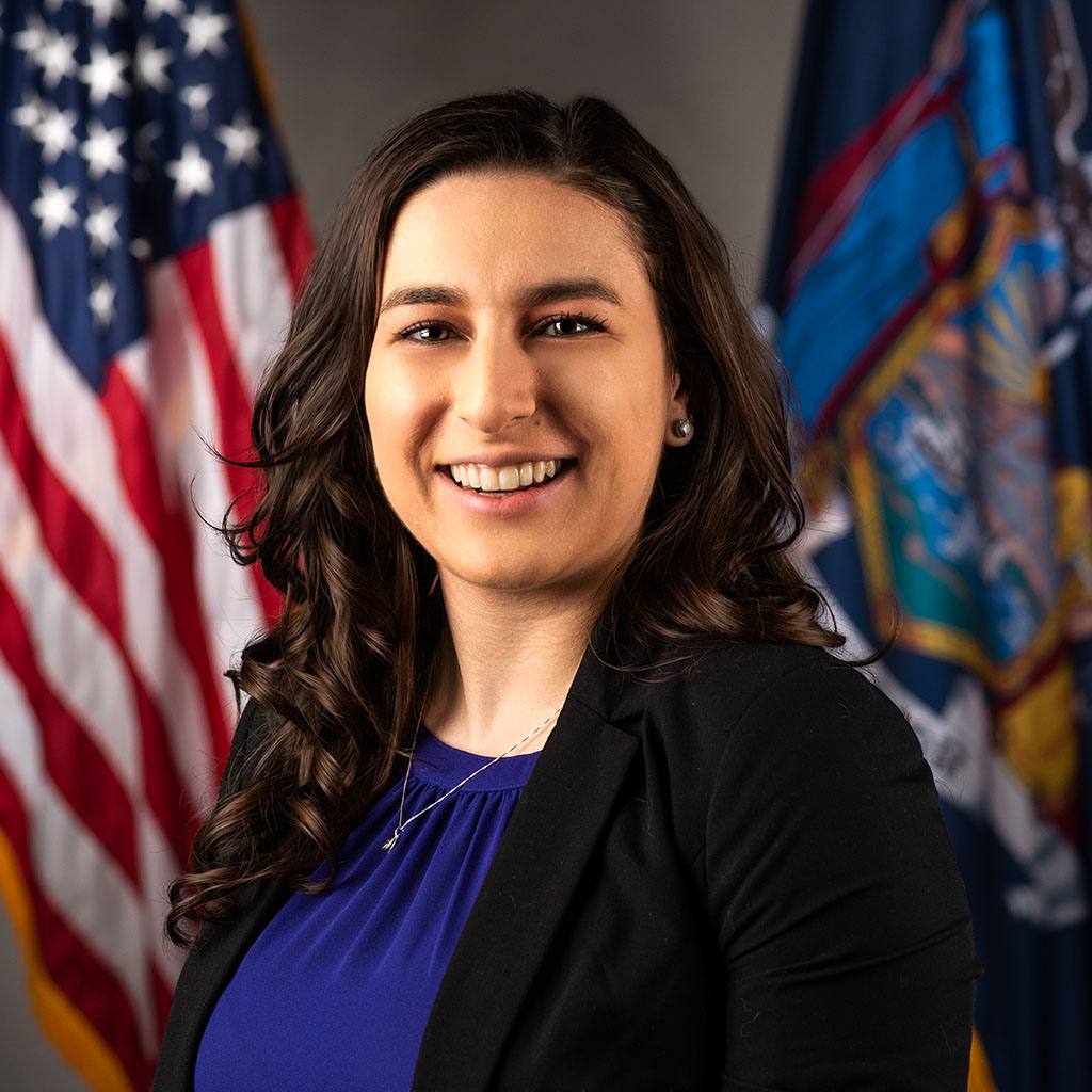 professional headshot of female employee wearing a suit