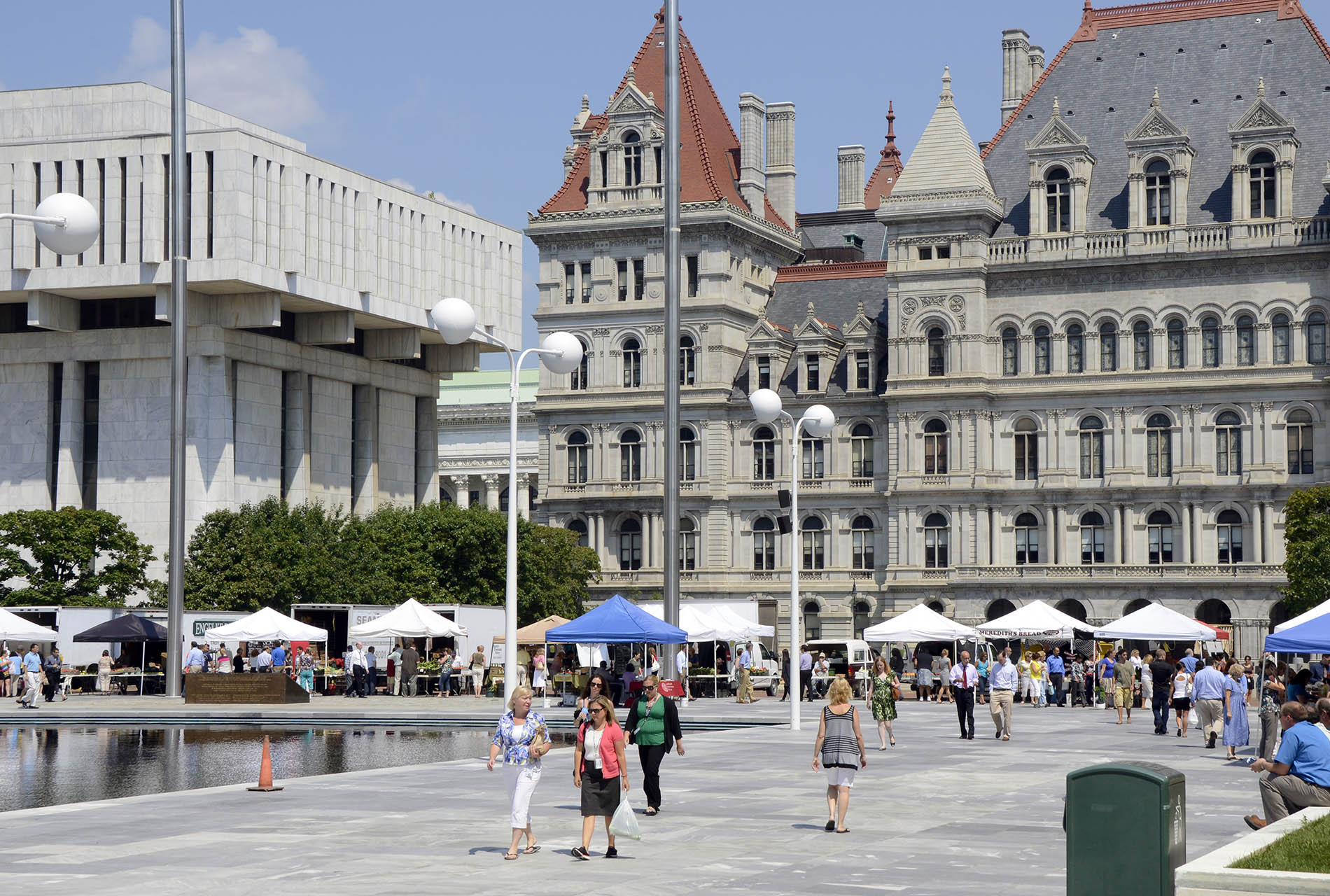 People enjoying the Farmers Market at the Empire State Plaza by the State Capitol